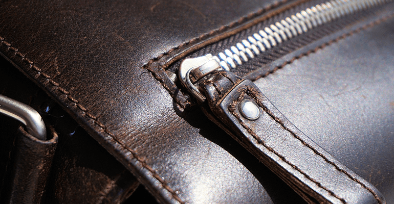 brown leather briefcase case with a silver zip - l