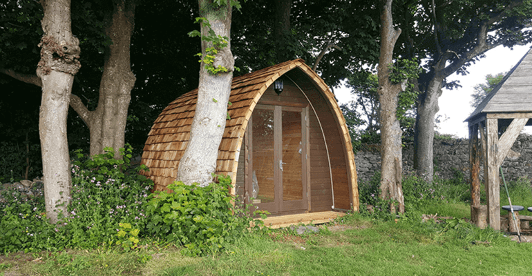 glamping pod set within trees - l