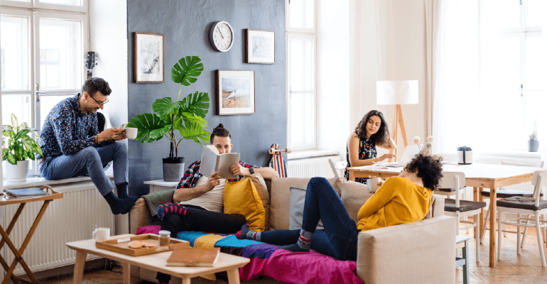 Group of students sitting in shared house.