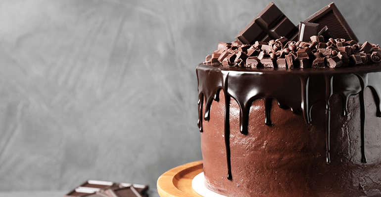 large chocolate cake on a cake stand - l