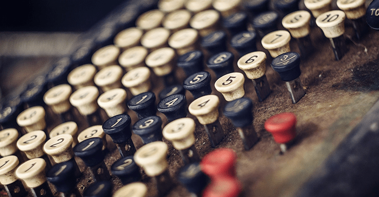 old fashioned calcuylator with black red and white keys - l