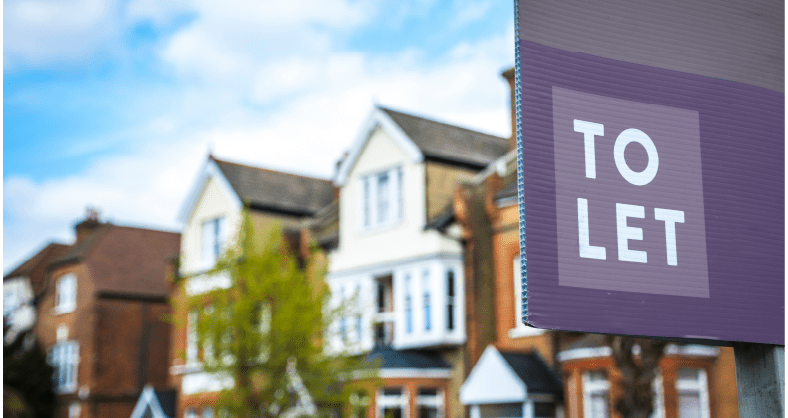 Purple to let sign outside of terraced houses 