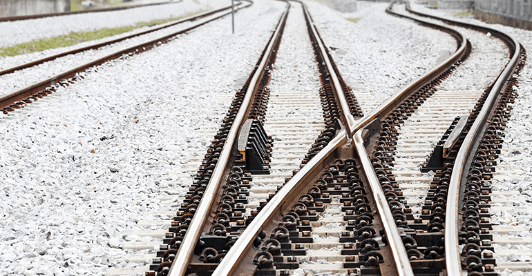 railway tracks crossing over each other - l