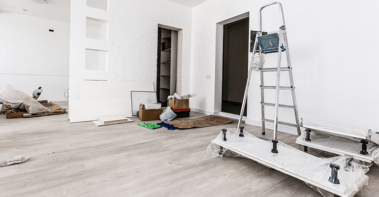 room in a property being renovated with decorating equipment in it - l