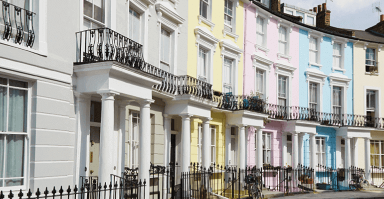 row of pastel coloured houses in a crescent - l