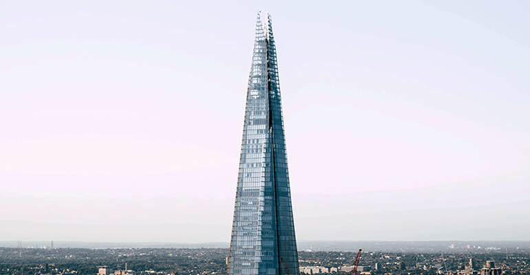 tall mirrored pyramid shaped building - l