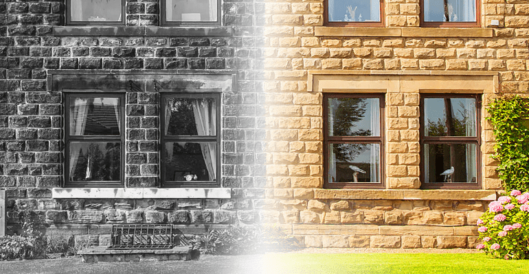 Traditional house with yellow brick half in black and white.