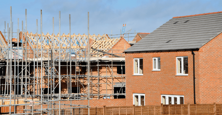 Two new build detached houses under construction.