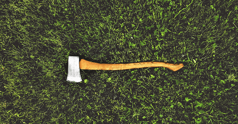 wooden axe on grass - l