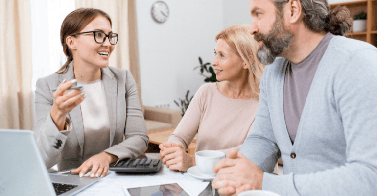 young cheerful financial advisor agent consulting a couple