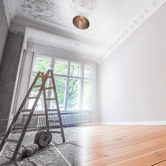 Step ladder in old run down black and white room to newly refurbished full colour room