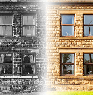 Black and white house side by side with a colourful sunny house