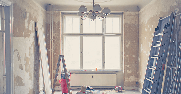 a room being refurbished with no wallpaper or doors on - l