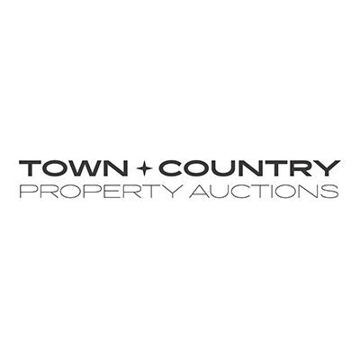 White logo with black writing stating Town and Country