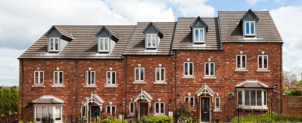 A row of terraced brick houses.