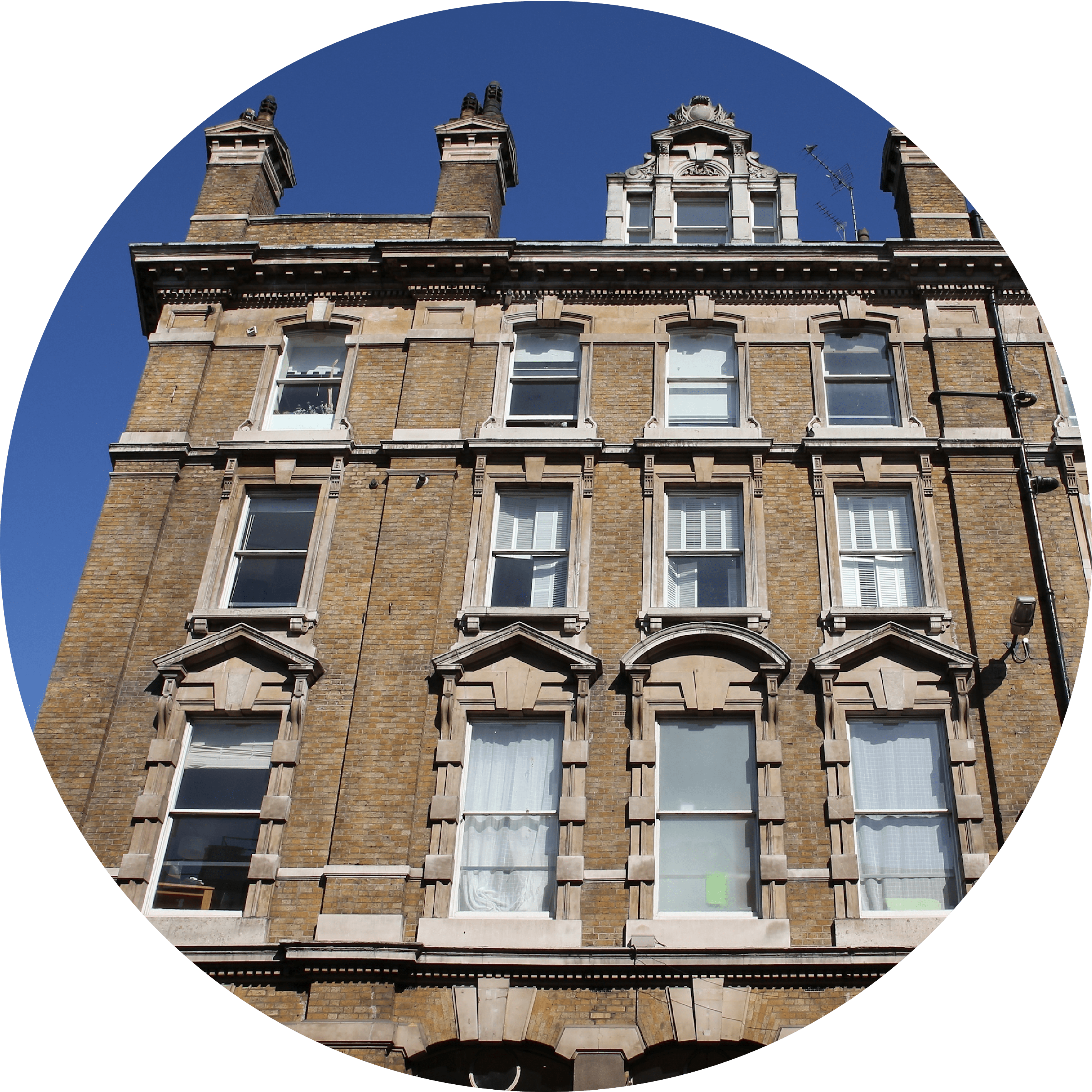 A long shot looking up at a 5 story terraced house.