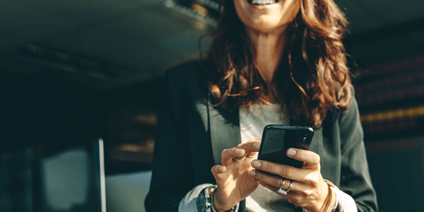 Business executive using a phone in office.