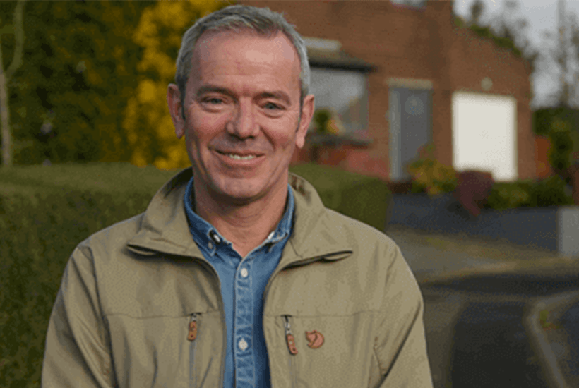 Simon OBrien of the Great House Giveaway standing on a residential road