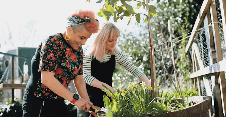 two women gardening - l