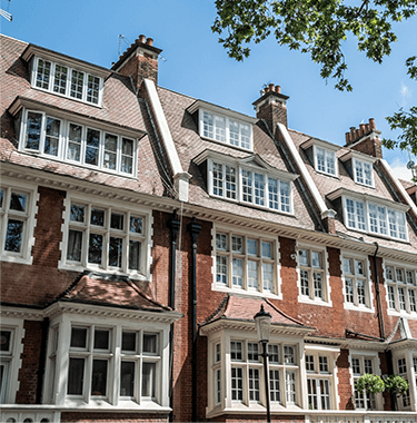 A row of red brick terraced houses.