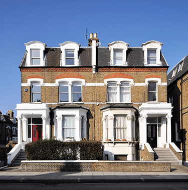 Two semi-detached houses with yellow brick.