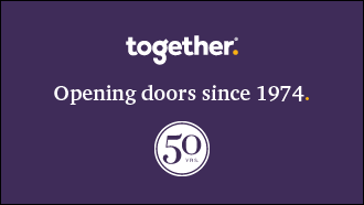 A purple screen quoting opening doors since 1974 with a 50 logo underneath it.