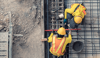 A birds eye view of construction men working.